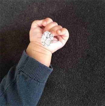 North West holds Kim’s Ring