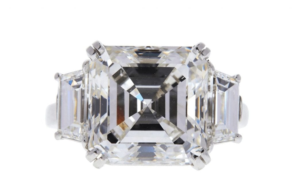 7.31 carat Asscher cut diamond positioned between two trapezoid diamonds